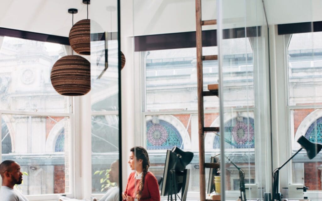 people talking in an office