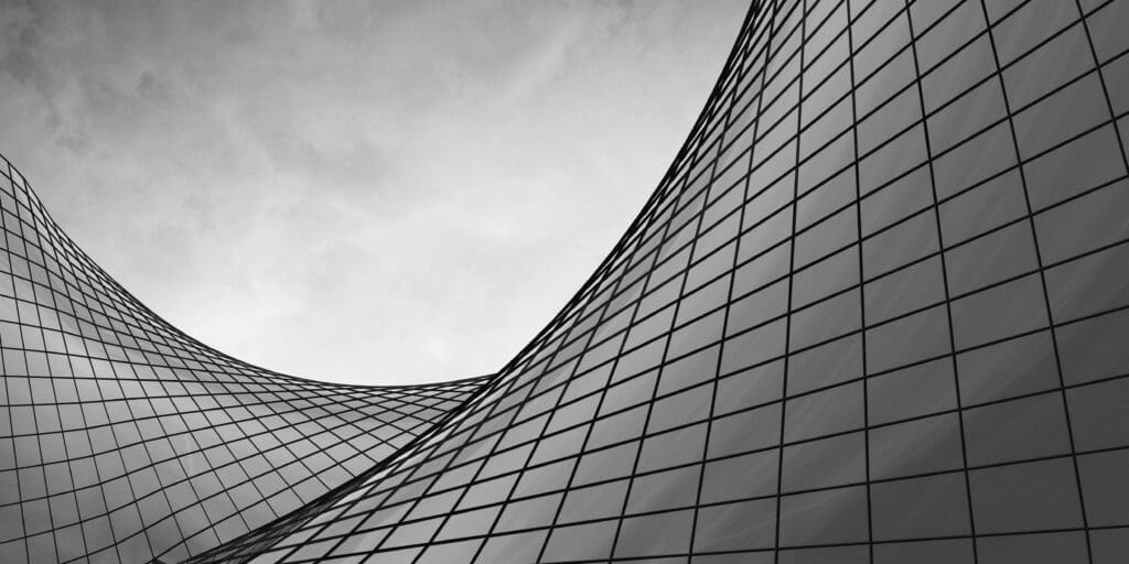 View of the clouds reflected in the curve glass office building.